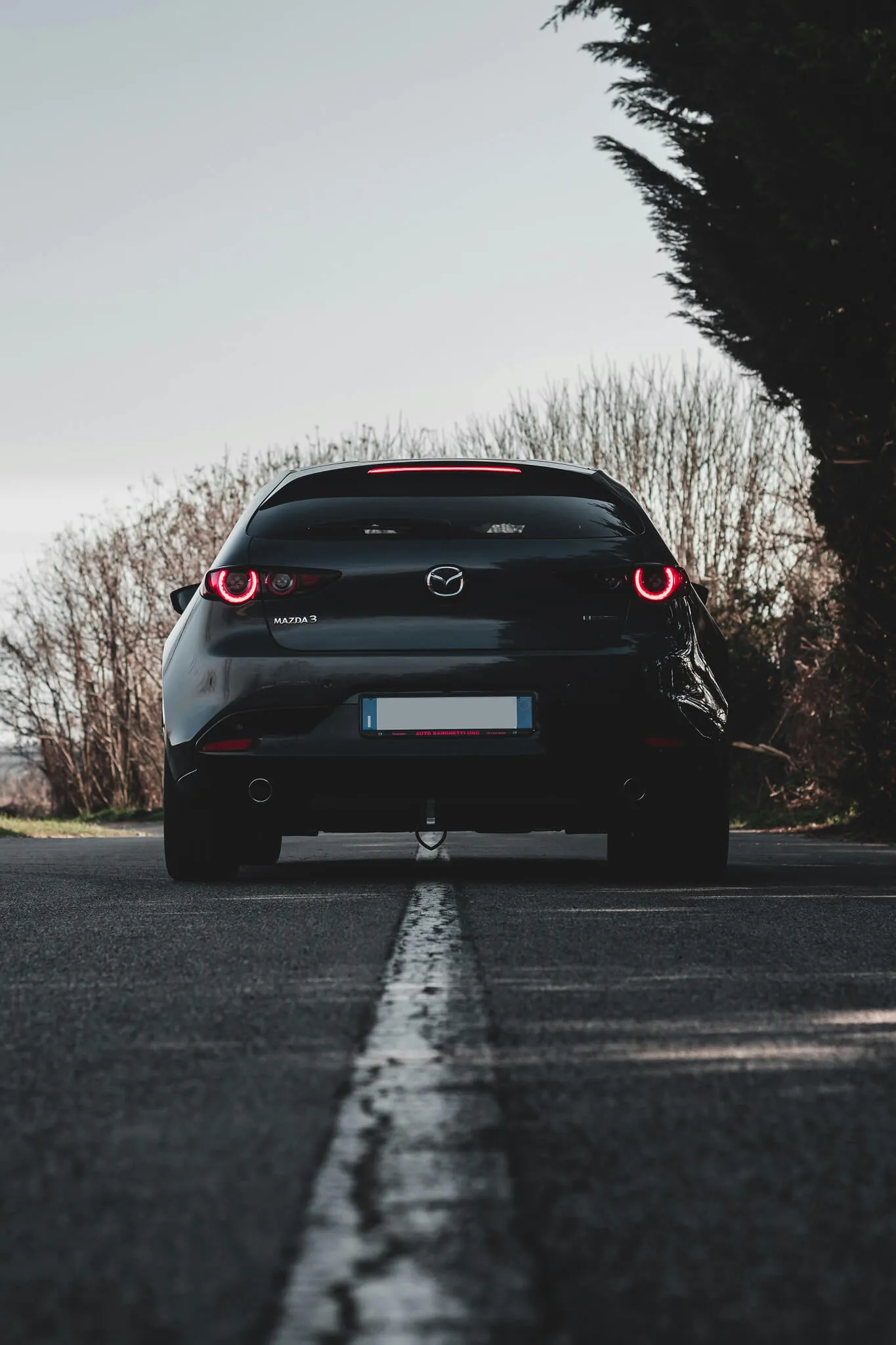 A Mazda car from behind