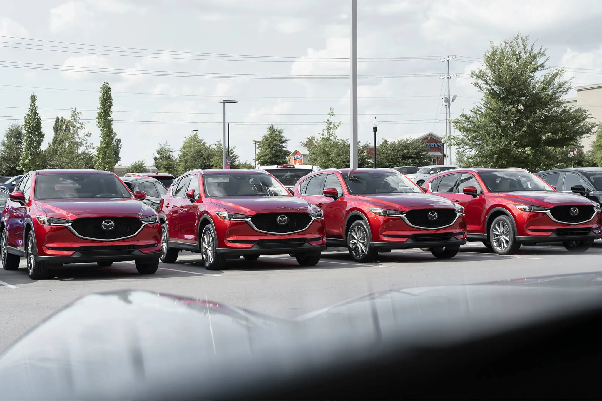 A Mazda dealership displaying its cars